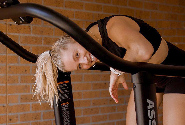 Women Smiling AssaultRunner Pro Treadmill | Gym and Fitness Membership Program
